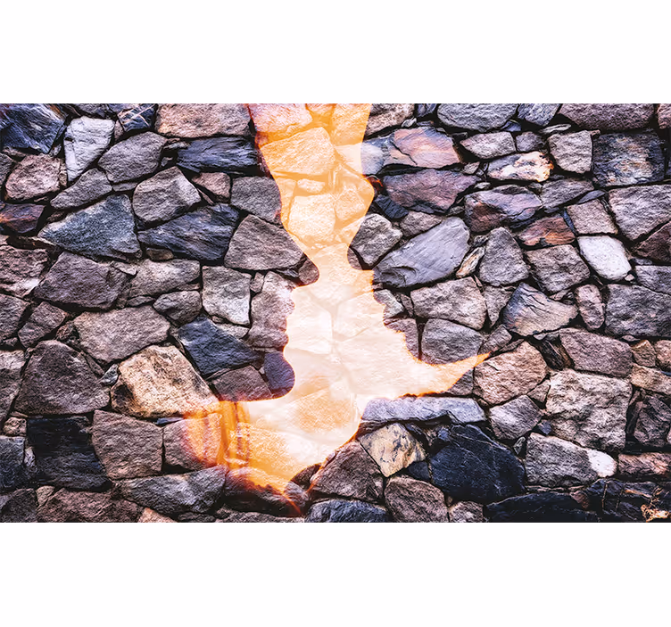 Abstract wall mural of silhouetted stone faces - TenStickers